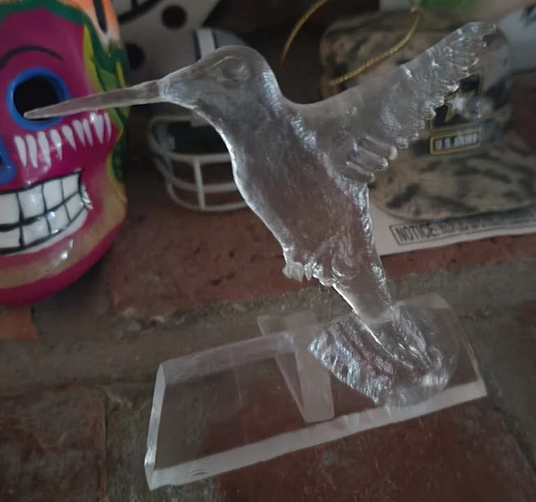 acrylic carved into a hummingbird