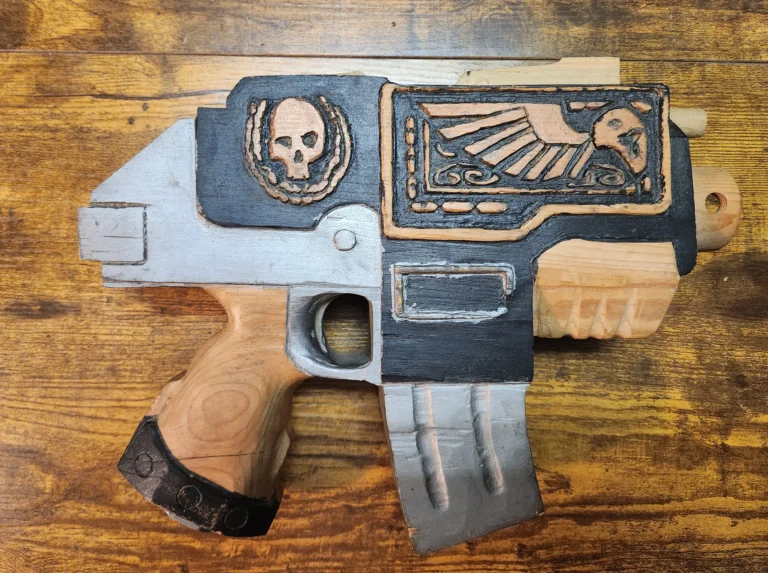 Handcarved wooden Warhammer 40k bolter pistol painted black and silver